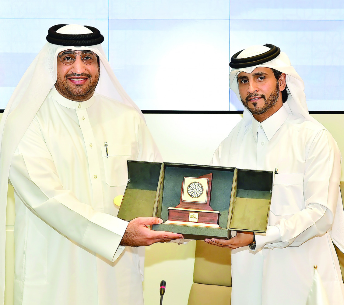 Qatar University and Qatar Olympic Academy officials after signing the agreement.