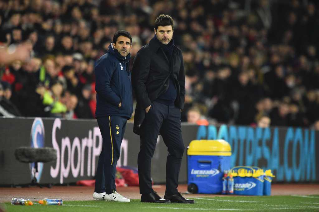 Tottenham Hotspur's Argentinian head coach Mauricio Pochettino (R) stands on the touchline during the English Premier League football match between Southampton and Tottenham Hotspur at St Mary's Stadium in Southampton, southern England on December 28, 201