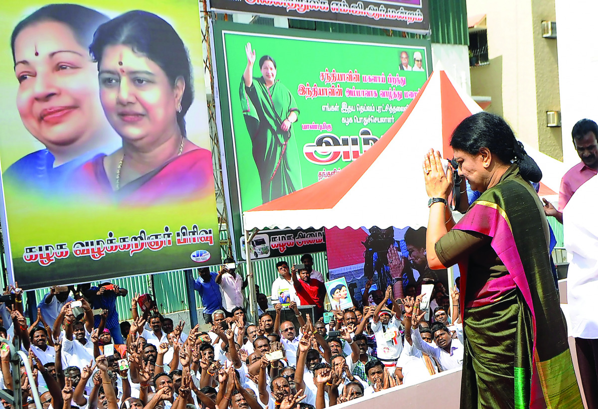 General secretary of southern Tamil Nadu state's ruling All India Anna Dravida Munnetra Kazhagam (AIADMK), VK Sasikala gestures to cadres on her arrival to take up office at the AIADMK headquarters in Chennai on December 31, 2016.
VK Sasikala was elected