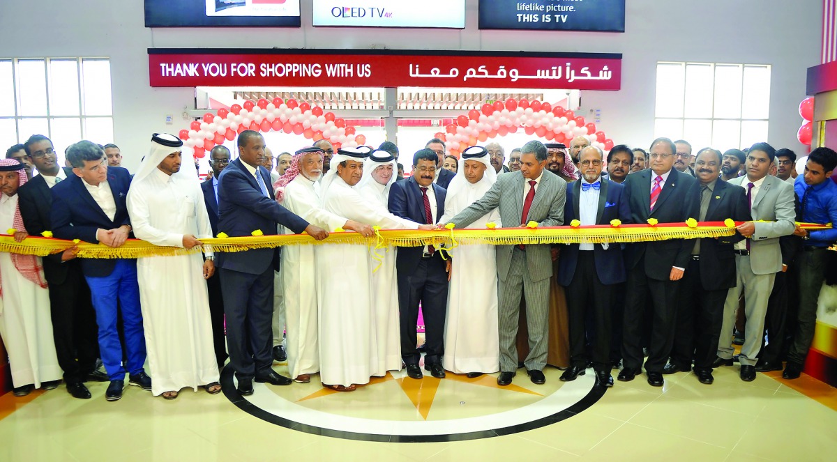 Sheikh Abdullah bin Ahmed bin Jassim Al Thani cutting the ribbon with P Kumaran, Ambassador of India, Shamsudheen Olakara, Chairman Quality Hypermarket, Dr R Seetharaman, Group Chief Executive Officer of Doha Bank, and other officials and guests during th