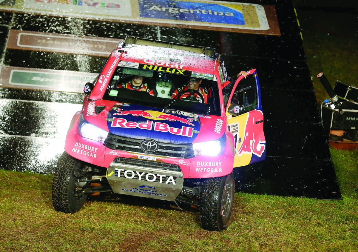Qatari driver Nasser Saleh Al Attiyah and co-driver  Matthieu Baumel drive their Toyota during the symbolic start from the podium during the departure ceremony of Dakar Rally 2017 in Asuncion, Paraguay yesterday.