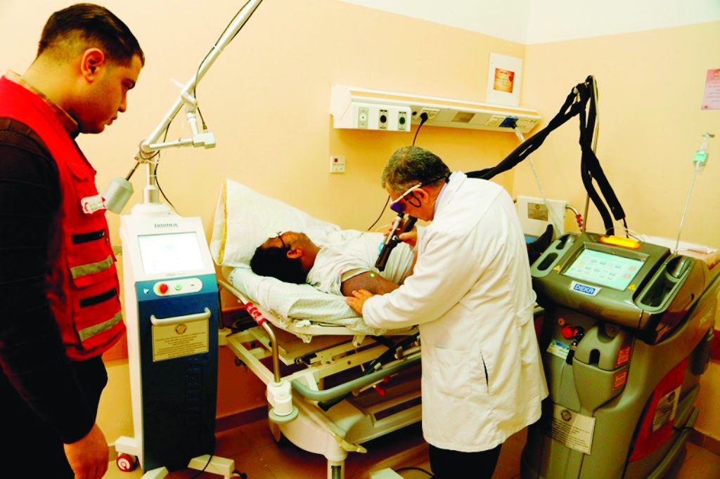 A patient being treated using the high-tech medical equipment procured by QRCS at a cost of $150,000.