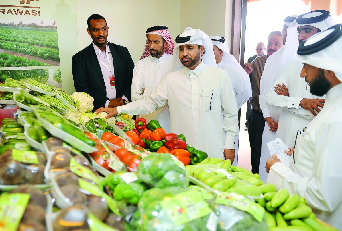 Dr Khalid bin Ibrahim Al Sulaiti, General Manager Katara (third left) with Salman Mohammad Al Naimi (second right), President of the committee of Mahaseel Festival at a stall after the opening of the festival at Katara, yesterday. Pic: Abdul Basit/The Pen
