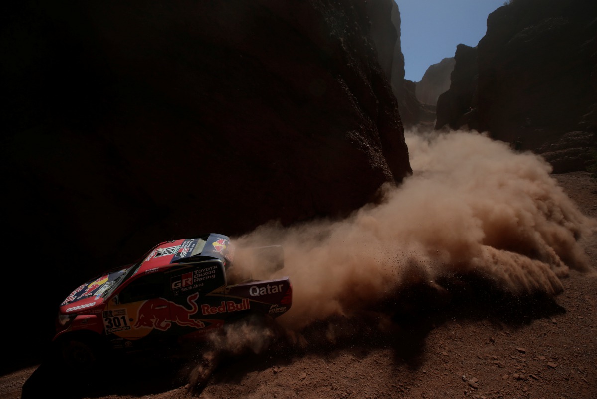 Nasser Al-Attiyah of Qatar drives his Toyota with his copilot Matthieu Baumel. (REUTERS/Ricardo Moraes)