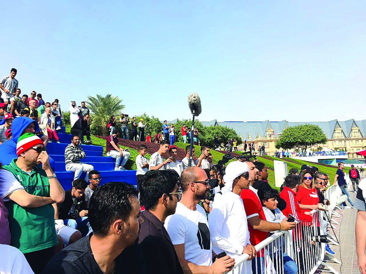 FC Bayern Munich fans watch their favourite stars in action during the team's winter training sessions at Aspire Zone’s outdoor football pitches yesterday.