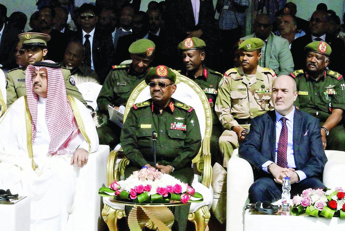Minister of State for Defence Affairs H E Dr Khalid bin Mohamed Al Attiyah with Sudanese President Omar Hassan Al Bashir and Turkey's Defence Minister Fikri Isik in Khartoum, Sudan, yesterday.