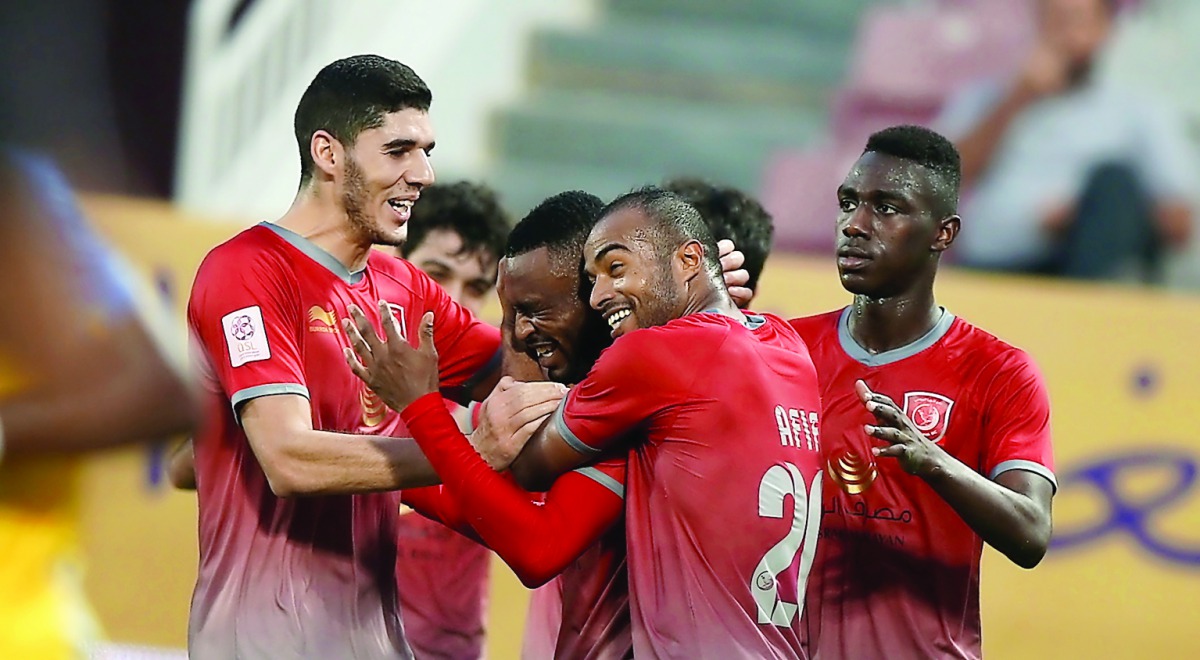 Lekhwiya players celebrate after scoring a goal against Al Gharafa in the Qatar Stars League match at Lekhwiya Stadium yesterday. Lekhwiya won 3-1. Pictures: Kammutty VP/The Peninsula