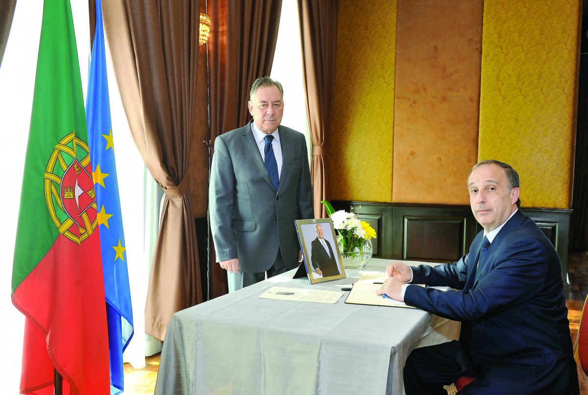 Portuguese Ambassador, Antonio Tanger (left), looks on as Ambassador of Uruguay, Dr Jorge Antonio Sere Sturzenegger, signs a book of condolence at The Pearl-Qatar yesterday for former President Portuguese Mario Soares, who died on January 7.  Pic: Kammutt