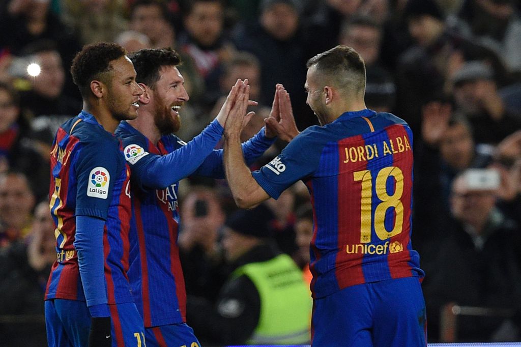Barcelona's Argentinian forward Lionel Messi celebrates with Barcelona's Brazilian forward Neymar (L) and Barcelona's defender Jordi Alba (R) after scoring a goal during the Spanish Copa del Rey (King's Cup) round of 16 second leg football match FC Barcel