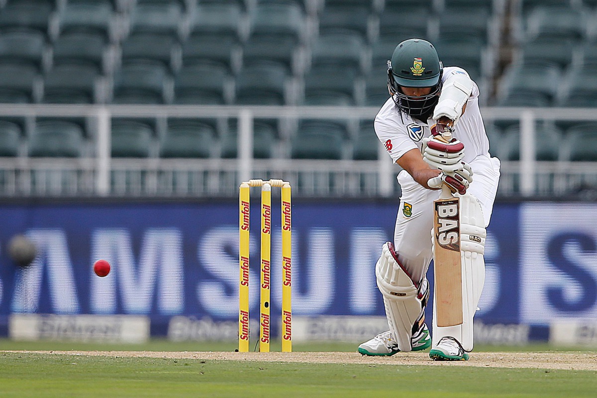 South African batsman Hashim Amla plays a shot during the third Test between South Africa and Sri Lanka on January 12, 2017 at Wanderers Cricket Stadium in Johannesburg. (AFP / MARCO LONGARI)
