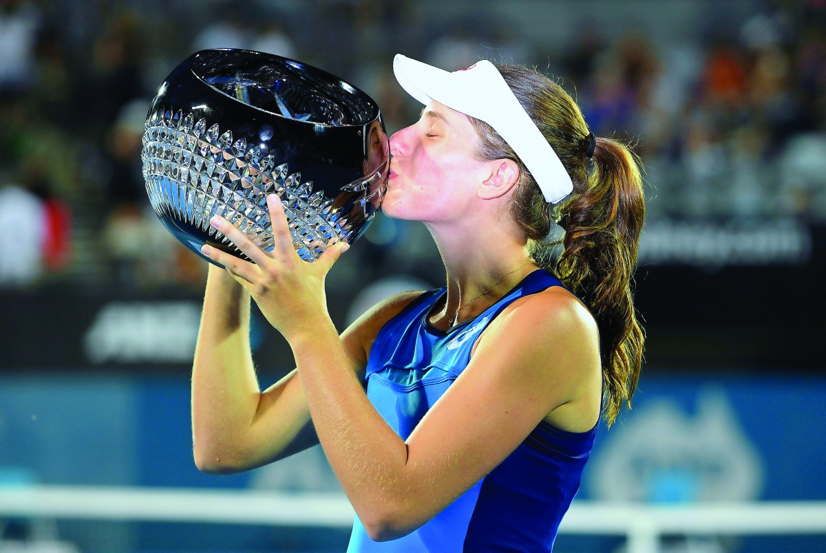 Britain's Johanna Konta kisses the trophy after winning the Women's Singles final at the Sydney International Tennis Tournament in Sydney, Australia, yesterday.
