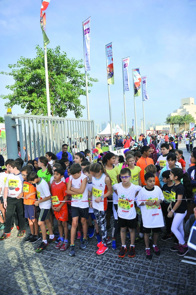 Young children participating in the fifth edition of the Ooredoo Marathon yesterday on the Doha Corniche.  Pic: Baher Amin/The Peninsula