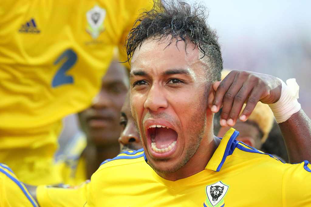 Gabon's forward Pierre-Emerick Aubameyang celebrates after scoring a goal during the 2017 Africa Cup of Nations group A football match between Gabon and Guinea-Bissau at the Stade de l'Amitie Sino-Gabonaise in Libreville on January 14, 2017. / AFP / Steve