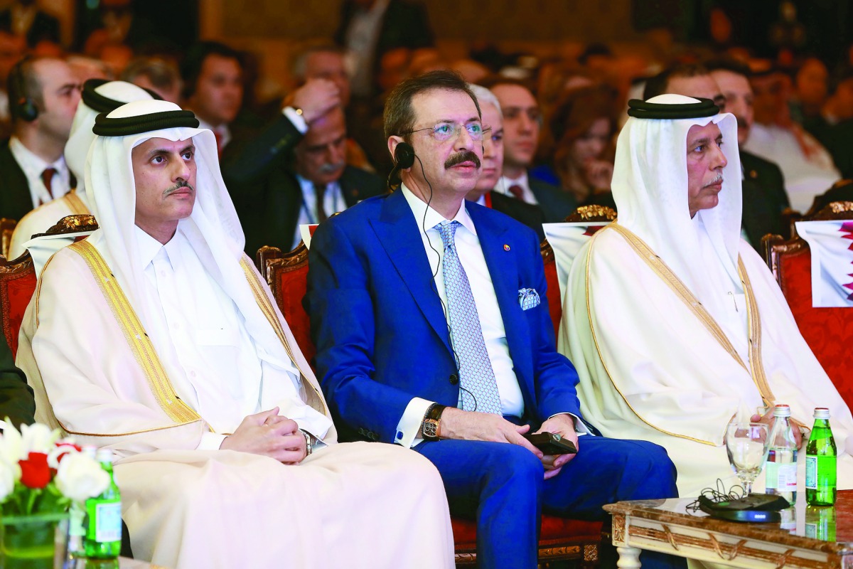 Deputy Prime Minister and Minister of State for Cabinet Affairs H E Ahmed bin Abdullah bin Zaid Al Mahmoud (right), Sheikh Dr Khalid bin Thani bin Abdullah Al Thani (first left), Chairman and Managing Director, QIIB and other officilas at the Qatar Chambe
