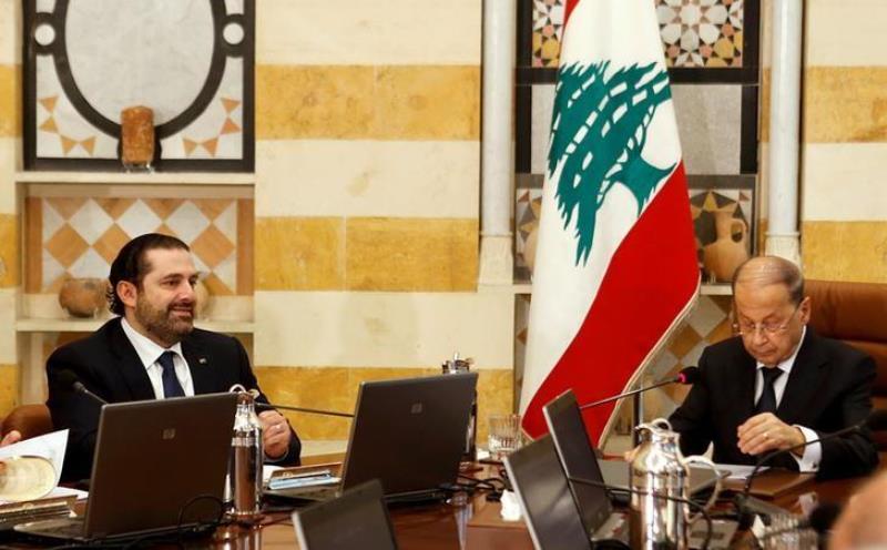 Lebanon's President Michel Aoun and Prime Minister Saad al-Hariri (L) attend the first meeting of the new cabinet at the presidential palace in Baabda, Lebanon January 4, 2017. REUTERS/Mohamed Azakir