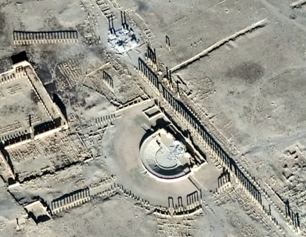 This handout picture provided on January 20, 2017 by UNITAR-UNOSAT and taken on January 10, 2017, shows a close-up of a satellite-detected image of the damaged Roman tetrapylon (top) and amphitheatre (C) in the ancient city of Palmyra in central Syria.  A