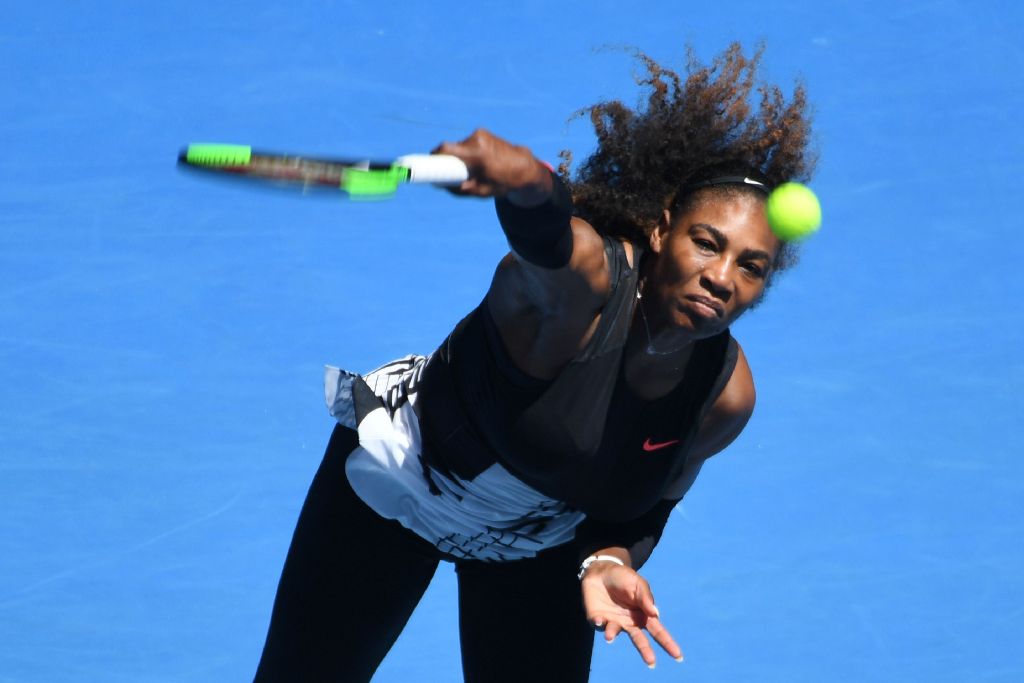 Serena Williams of the US serves against Nicole Gibbs of the US during their women's singles third round match on day six of the Australian Open tennis tournament in Melbourne on January 21, 2017.  AFP / SAEED KHAN