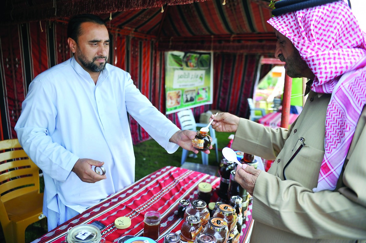 A local honey seller at Wakrah Vegetable yard. Pic: Abdul Basit/ The Peninsula