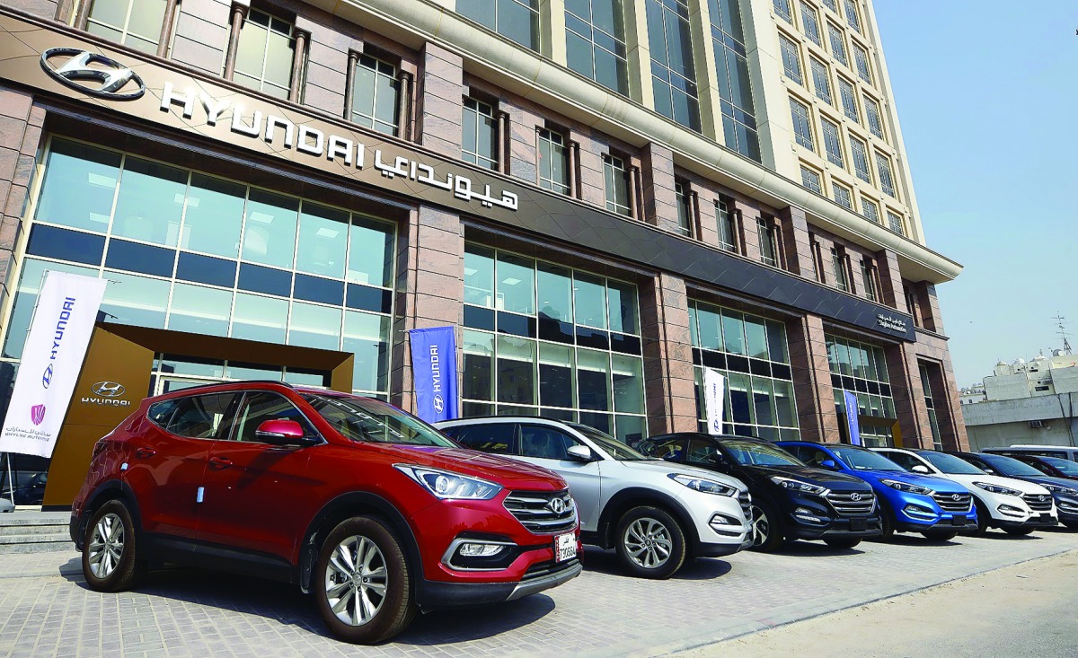 Skyline Automotive's 2017 model cars in the outdoor of B-Ring Road Showroom - Hyundai in Doha. (Right) vehicles showcased inside the show room.