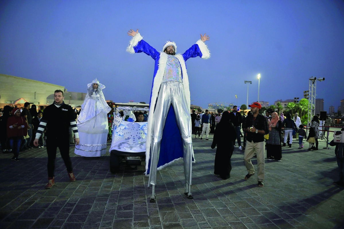 A stilt walker entertains the crowd on the last day of Winter Festival at Katara yesterday. Pic Baher Amin / The Peninsula