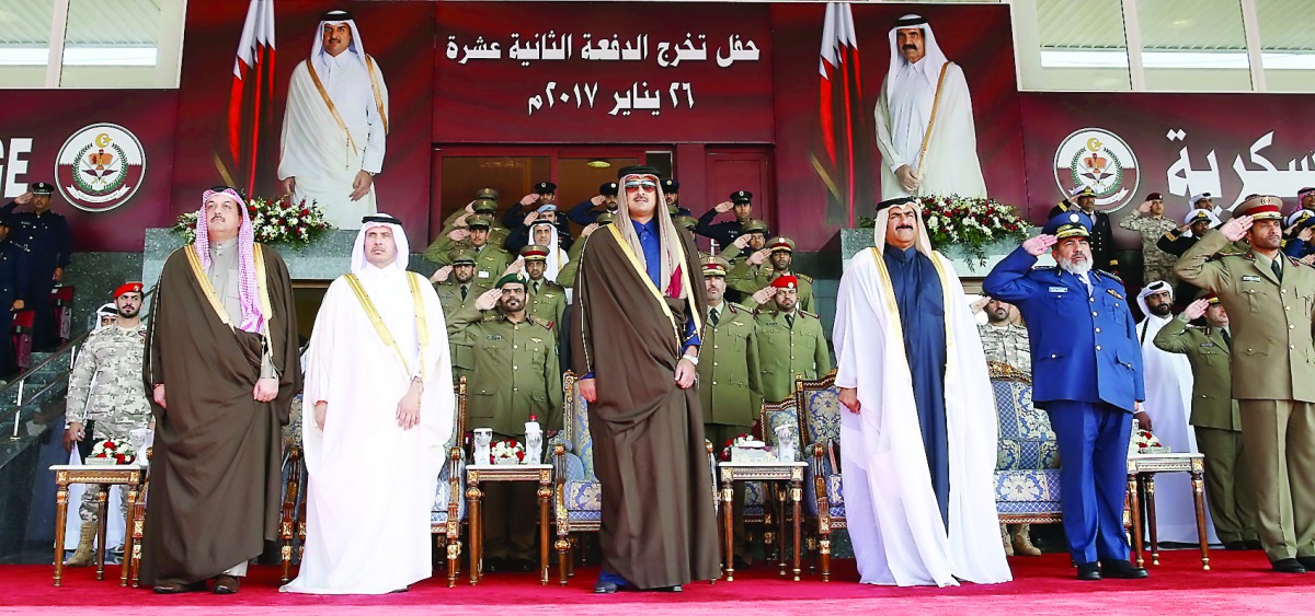 Emir H H Sheikh Tamim bin Hamad Al Thani at the graduation ceremony of the 12th class of officer cadets of the Ahmed bin Mohammed Military College, yesterday.