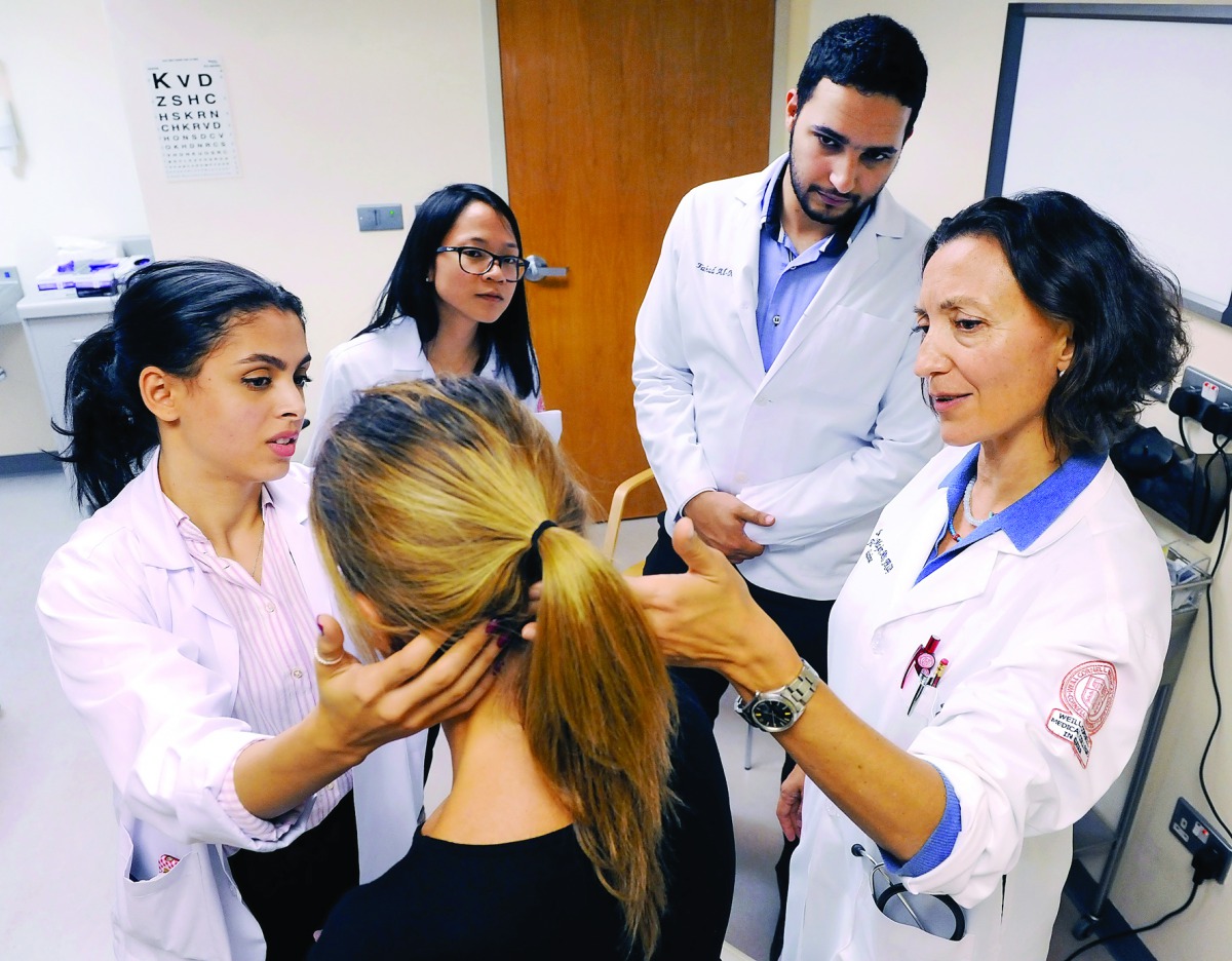 Dr Stella Major (right) teaching WCM-Q students essential physicianship skills in the college’s state-of-the-art Clinical Skills Center. 