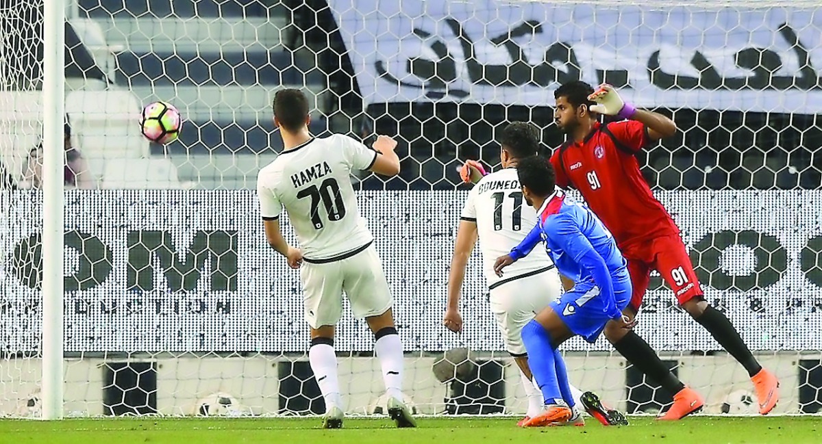 Al Sadd's Baghdad Bounedjah (11) scores against Al Shahaniya during their QSL match at Al Sadd Stadium yesterday.