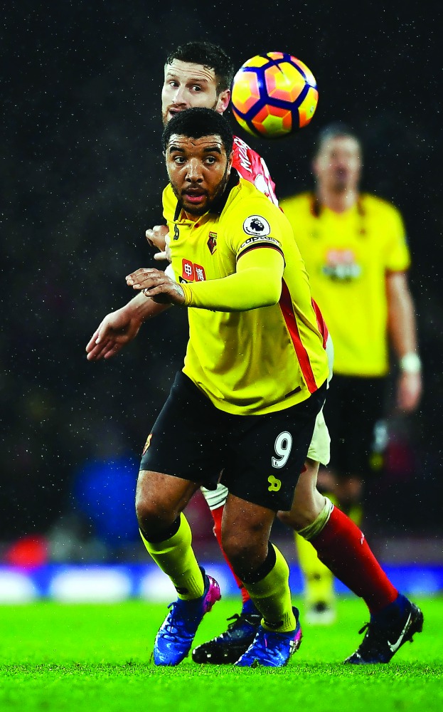 Watford's Troy Deeney in action with Arsenal's Shkodran Mustafi during the English Premier League at the Emirates Stadium on Tuesday.