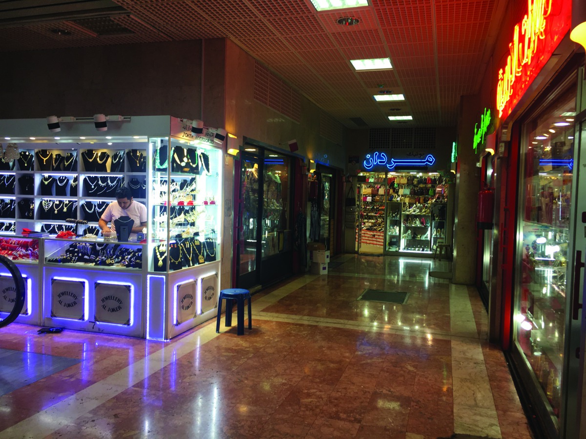 Traders at Souq Al Dira waiting for customers.
