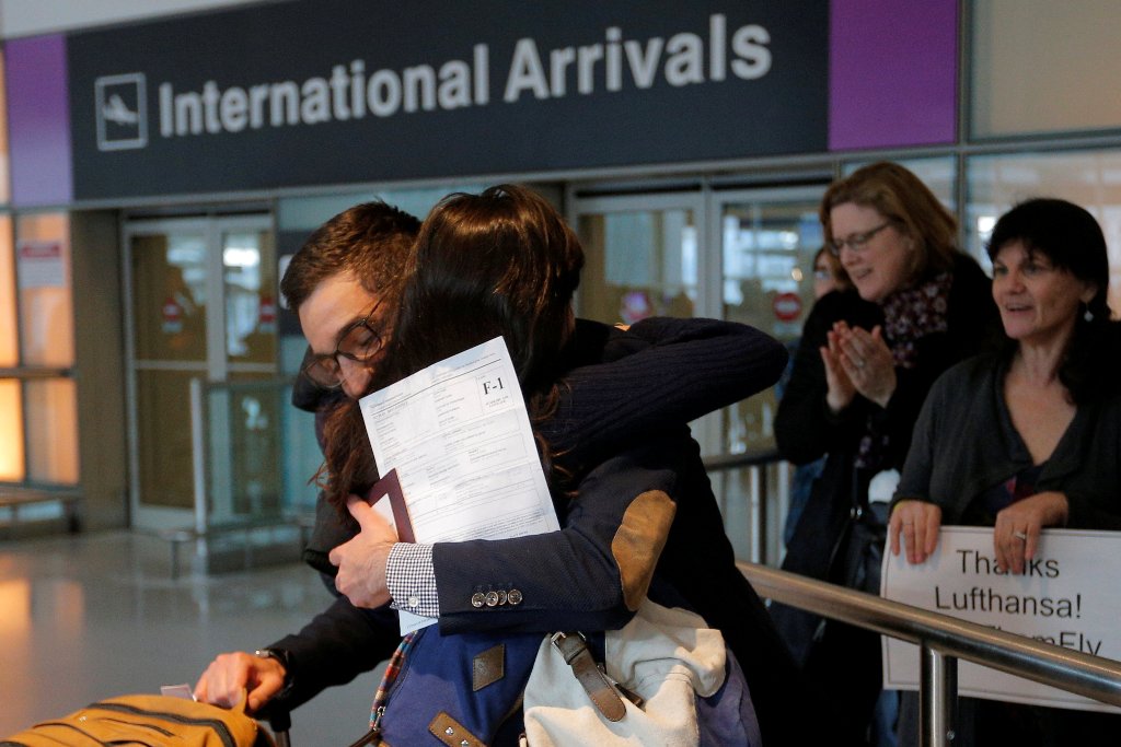 Behnam Partopour, a Worcester Polytechnic Institute (WPI) student from Iran, is greeted by his sister Bahar (L) at Logan Airport after he cleared U.S. REUTERS/Brian Snyder
