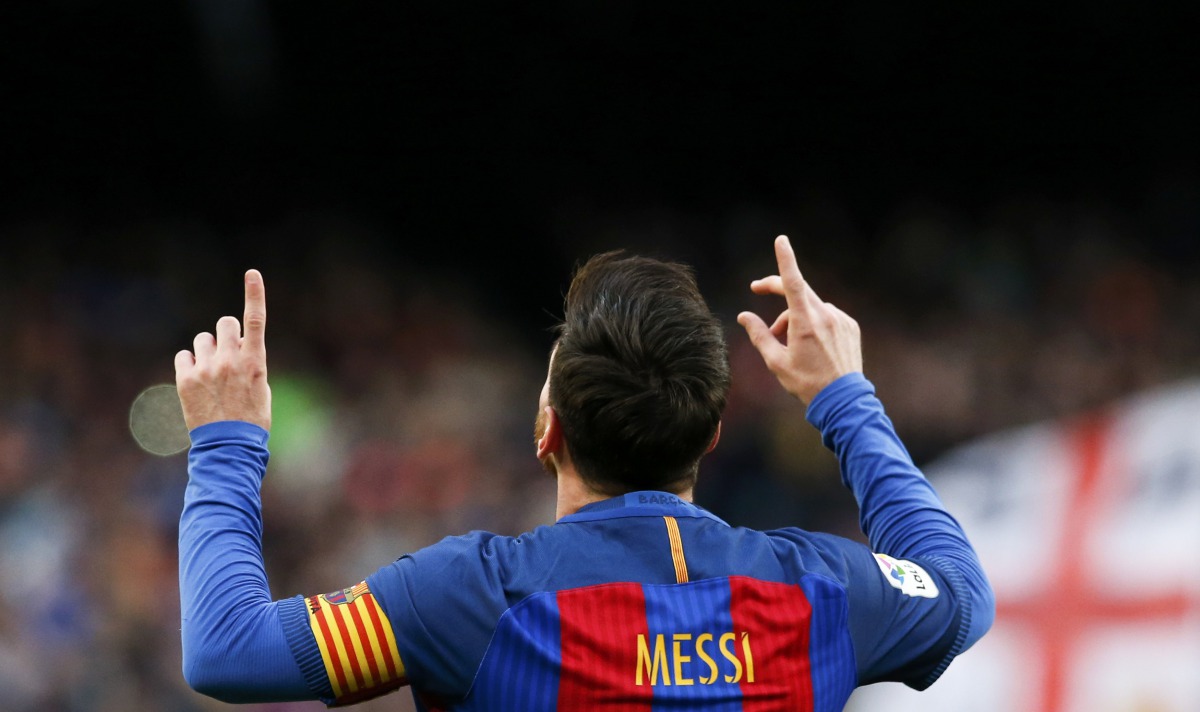  Barcelona's Lionel Messi celebrates after scoring their second goal. (REUTERS/Albert Gea)