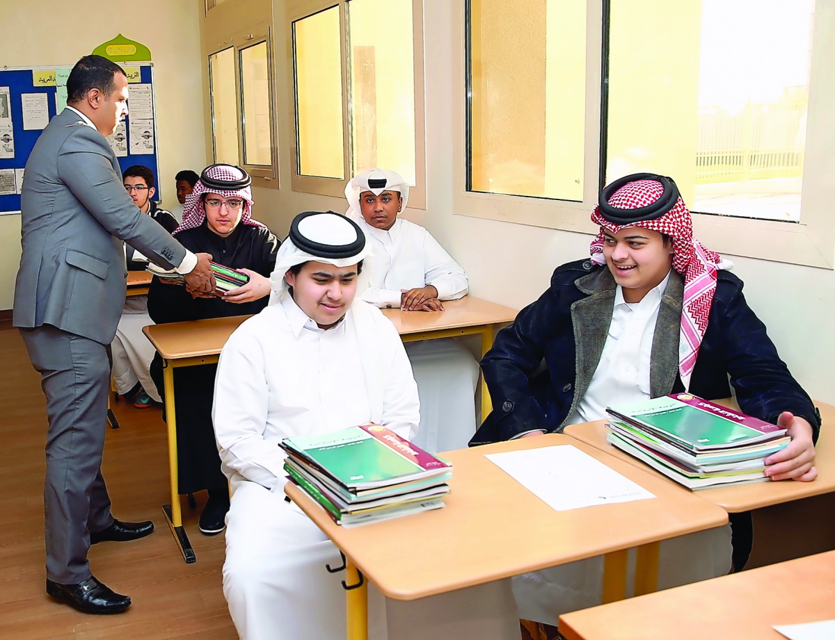 A teacher and students at Hassan bin Thabit Independent Secondary School for Boys yesterday.