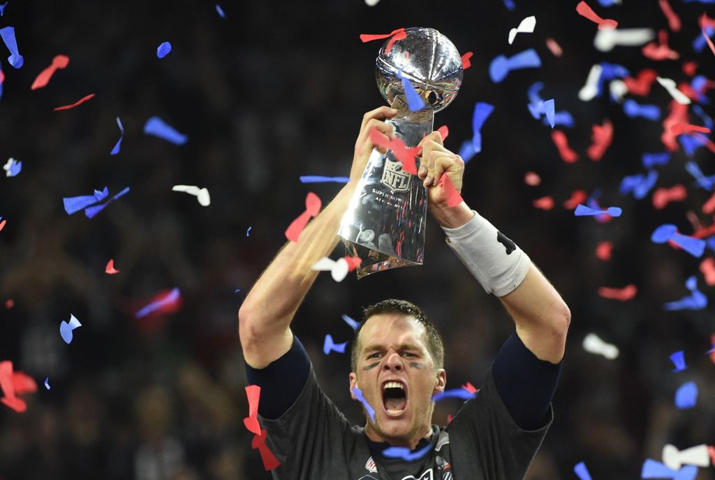 Tom Brady #12 of the New England Patriots holds the Vince Lombardi Trophy after defeating the Atlanta Falcons 34-28 in overtime during Super Bowl 51 at NRG Stadium on February 5, 2017 in Houston, Texas. AFP / Timothy A. CLARY
