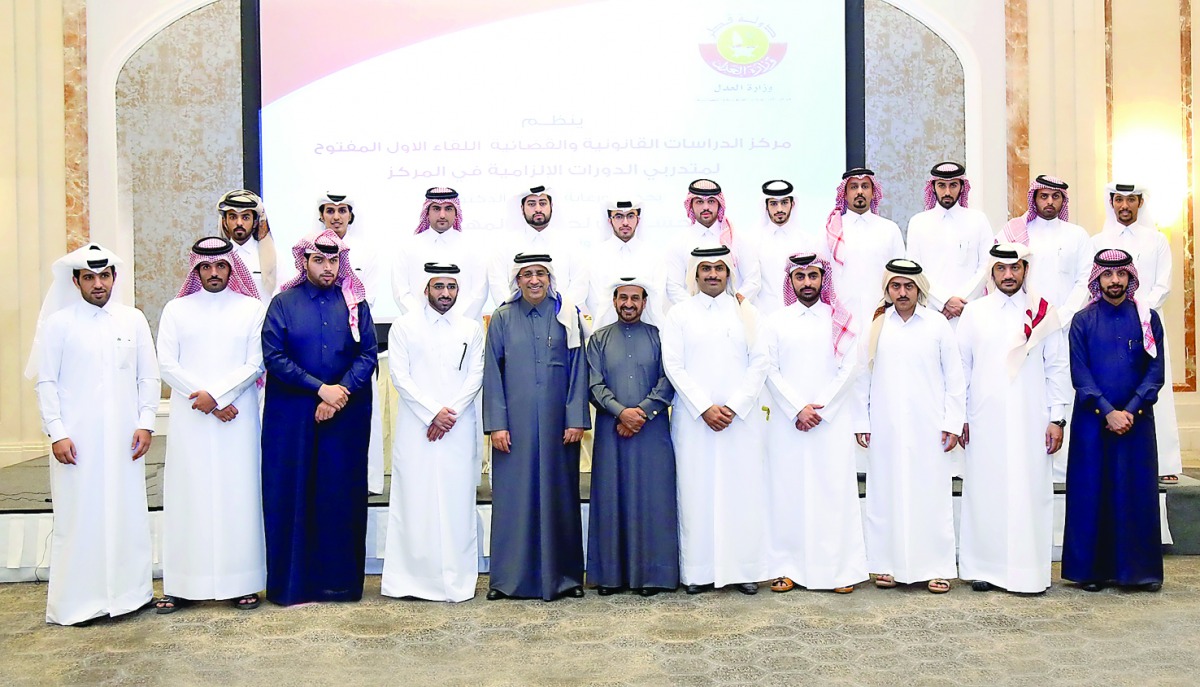 Minister of Justice H E Dr Hasan bin Lahdan Al Mohannadi with the trainees.