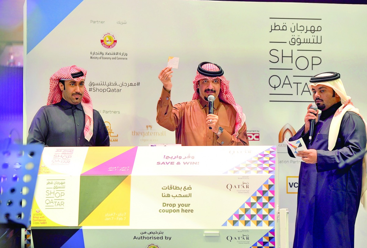 Officials declare the winner at the raffle draw on the concluding day of Shop Qatar festival, yesterday. Pic Abdul Basit / The Peninsula