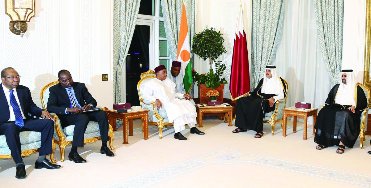 Emir H H Sheikh Tamim bin Hamad Al Thani with President of the Republic of Niger Mahamadou Issoufou at Emiri Diwan, yesterday. ? See also page 20