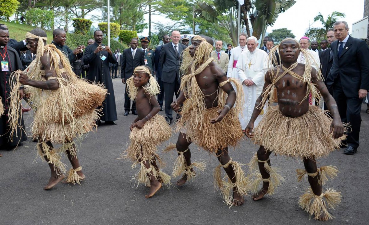 A group of pygmies from Cameroon's Baka tribe dance for Pope Benedict XVI before his departure for Angola to start the second leg of his trip to Africa, in Yaounde March 20, 2009. REUTERS/Osservatore Romano/Pool