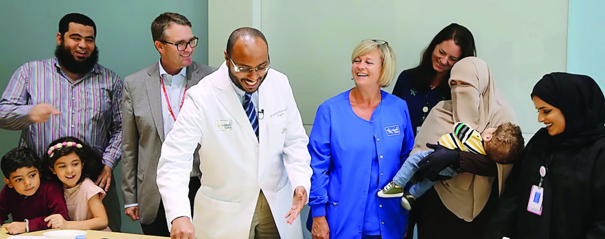 Baby Mohamed’s family with doctors at an event in the Outpatient Clinic.