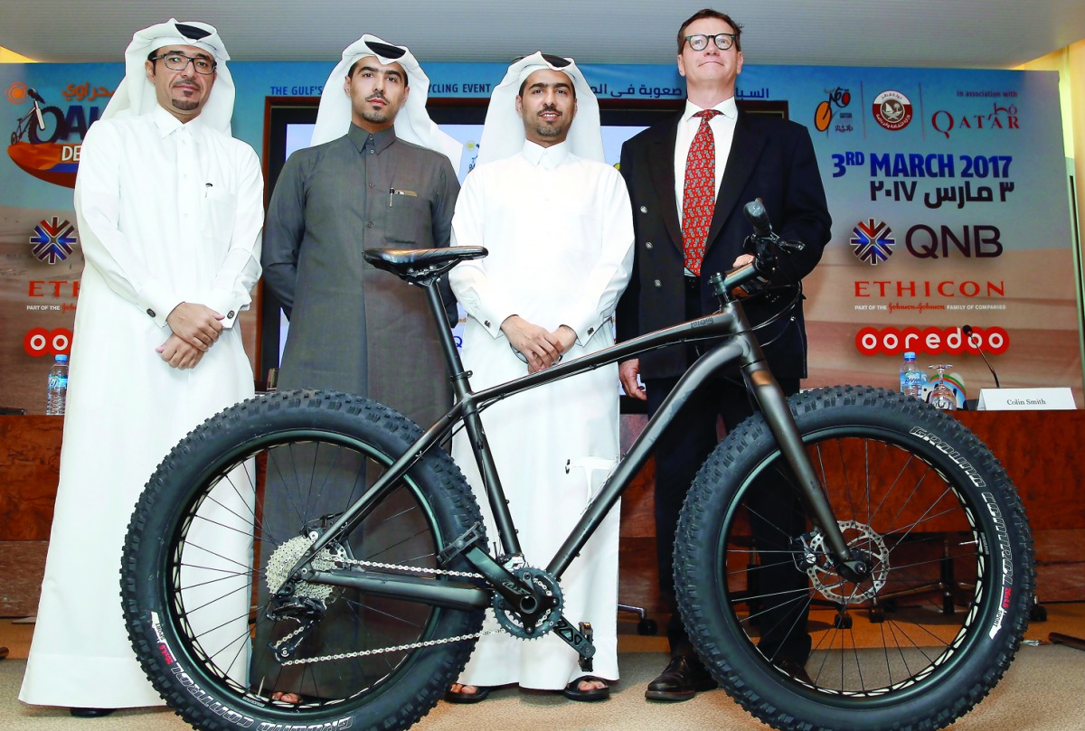Dr Jamal Al Khanji (left), Managing Director of Al Adaid Desert Challenge, poses for a picture along with Dr. Mohamed Al Kuwari (second left), President Cycling Federation, Dr. Abdulaziz Al Kuwari (second right), Director, Qatar Cyclist Centre and Colin S