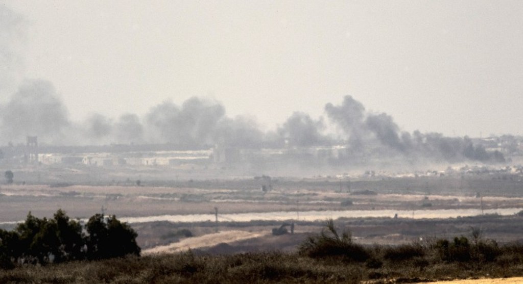 A picture taken from the Israel-Gaza border shows smoke rising from the Hamas-ruled Gaza Strip following an Israeli military strike on October 5, 2016. (Jack Guez/AFP).