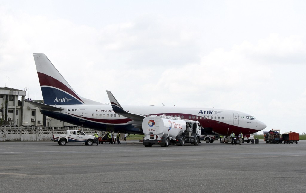 A Boeing 737-7BD Arik Air aeroplane is seen parked on the tarmac at the local airport in Lagos November 2, 2012. REUTERS/Akintunde Akinleye
