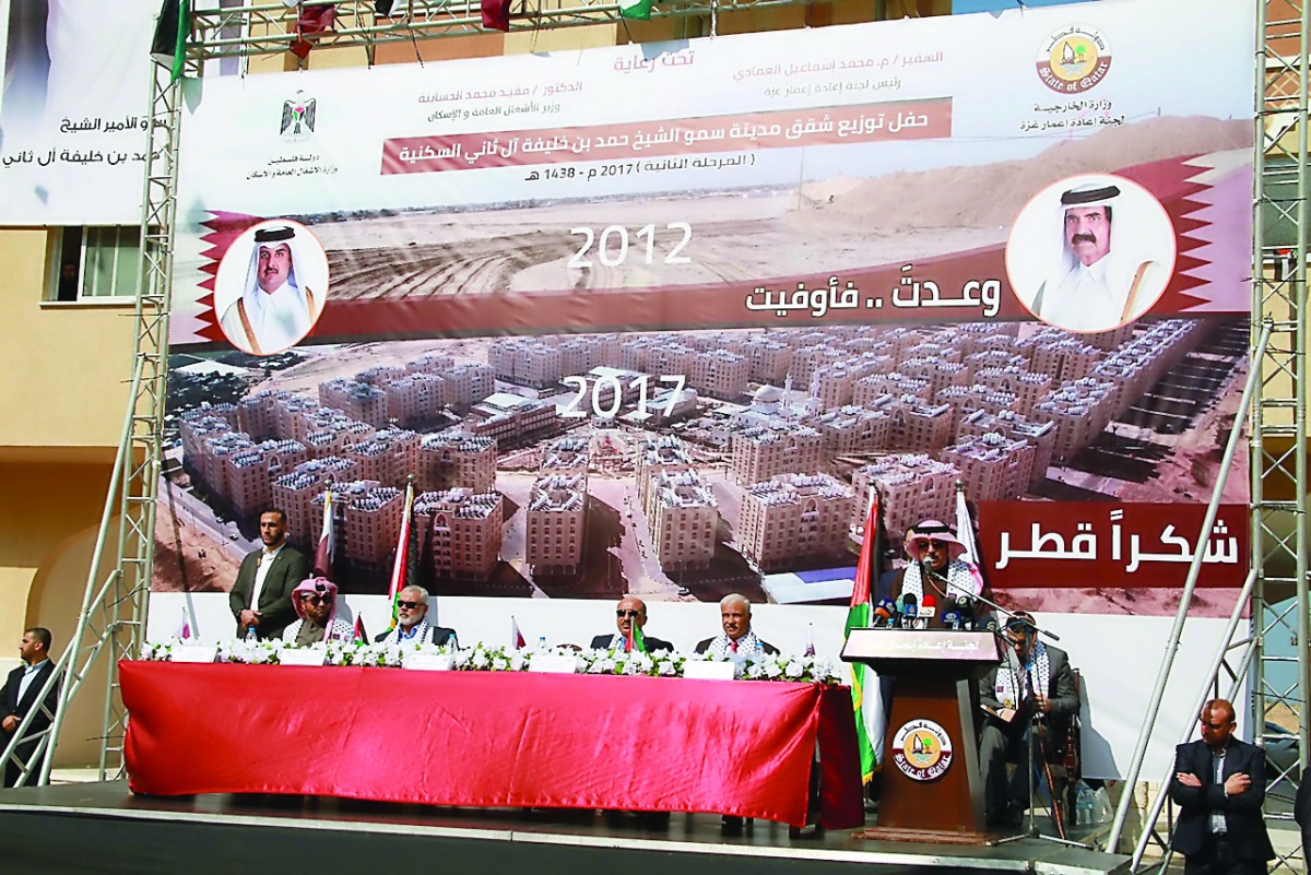 A ceremony being held for handing over apartments of the second phase of residential city of H H Sheikh Hamad bin Khalifa Al Thani in Khan Younis in southern Gaza Strip, yesterday.