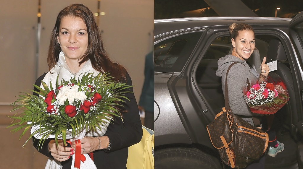 Polish player Agnieszka Radwanska (left) and  Slovakian tennis player Dominika Cibulkova arriving in Doha.