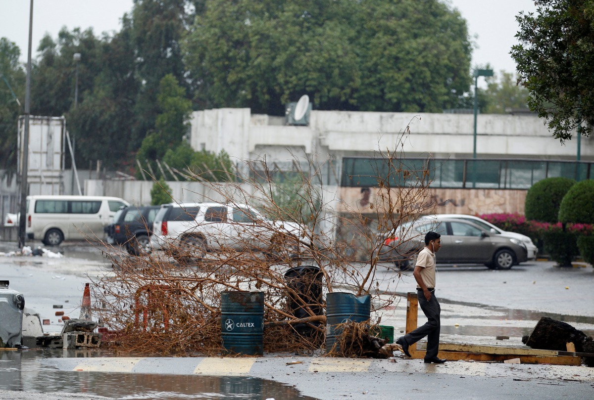 A pedestrian takes a detour to avoid road blocks set up by anti-government protesters to mark the 6th anniversary of February 14 uprising in the village of Saar, west of Manama, Bahrain February 14, 2017. Reuters/Hamad I Mohammed