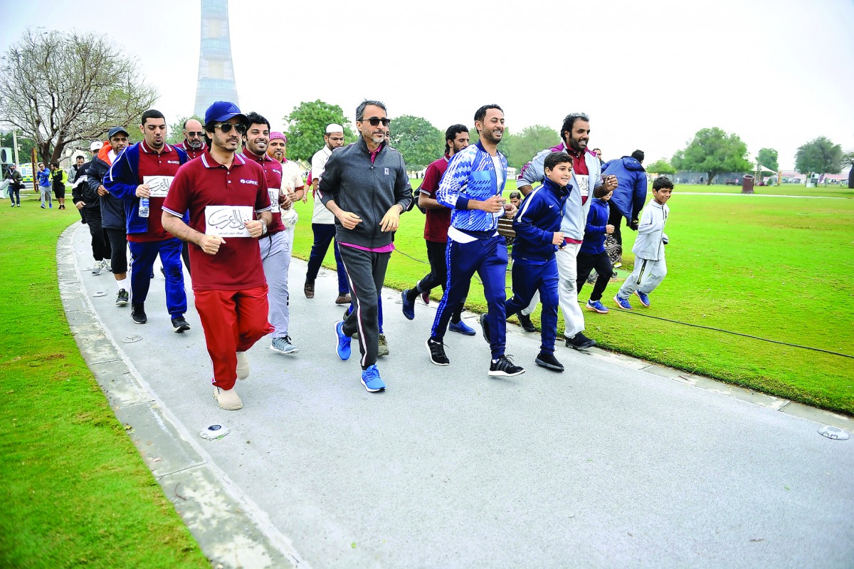 Minister of Culture and Sports, H E Salah bin Ghanem Al Ali, participating in the National Sport Day celebrations at Aspire Park, yesterday.    Pictures: Baher Amin / The Peninsula