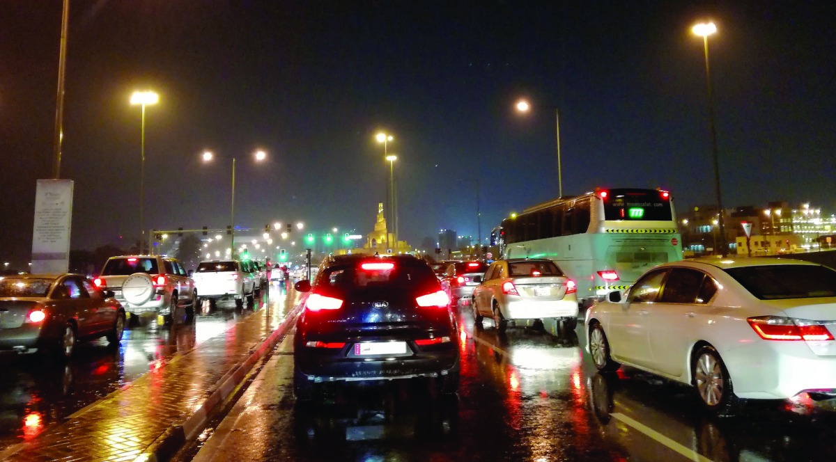 Vehicles moving on the Corniche Road during the drizzling last evening.  Pic: Salim Matramkot/The Peninsula