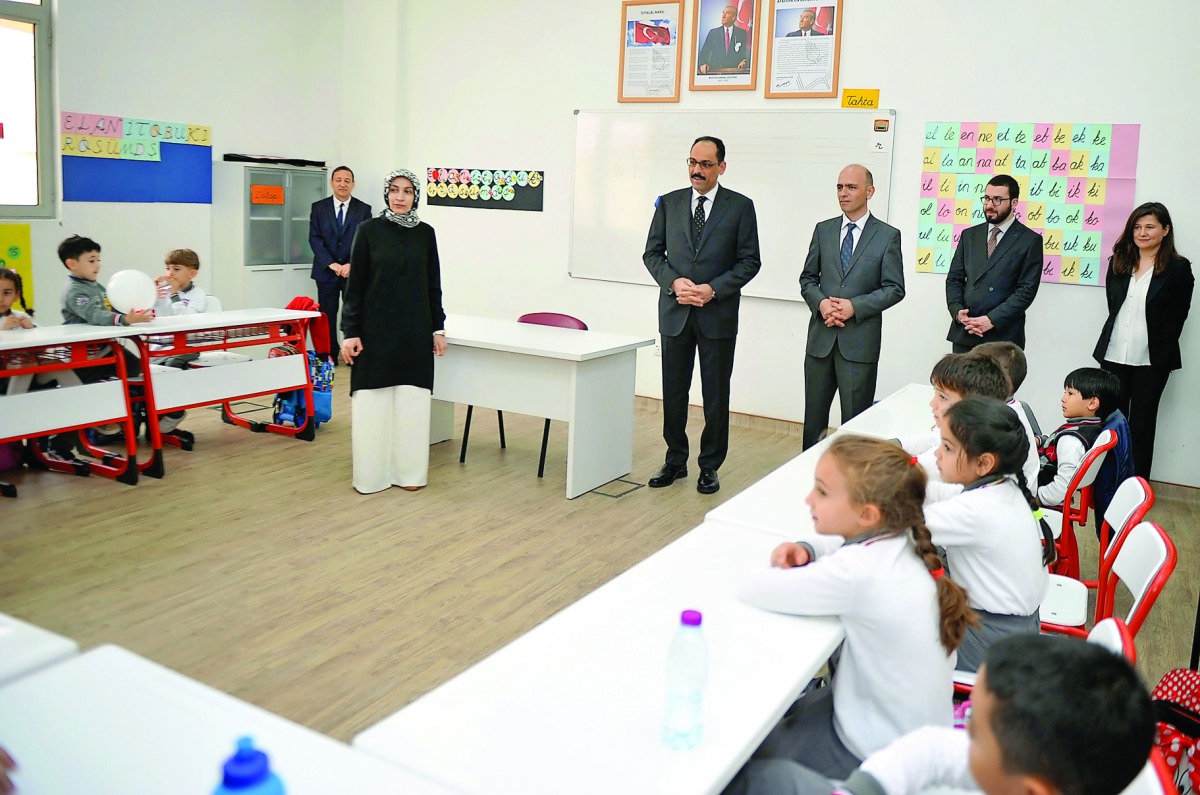 Deputy Secretary-General of the Turkish Presidency Prof Ibrahim Kalin and Principal of the Turkish School Mehmet Ali talking to students during a visit after the opening of the Turkish School in Doha yesterday. Pic: Abdul Basit / The Peninsula