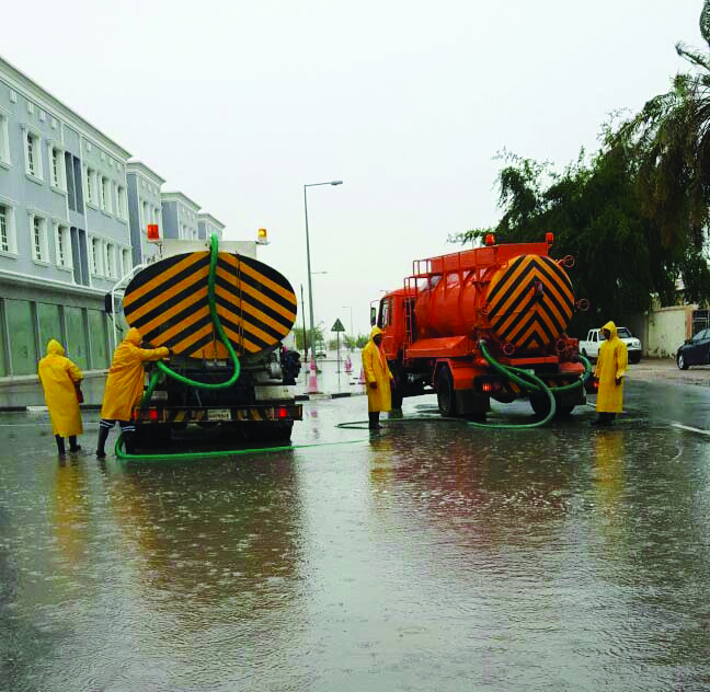 Rain water being pumped out from an inundated street yesterday. 