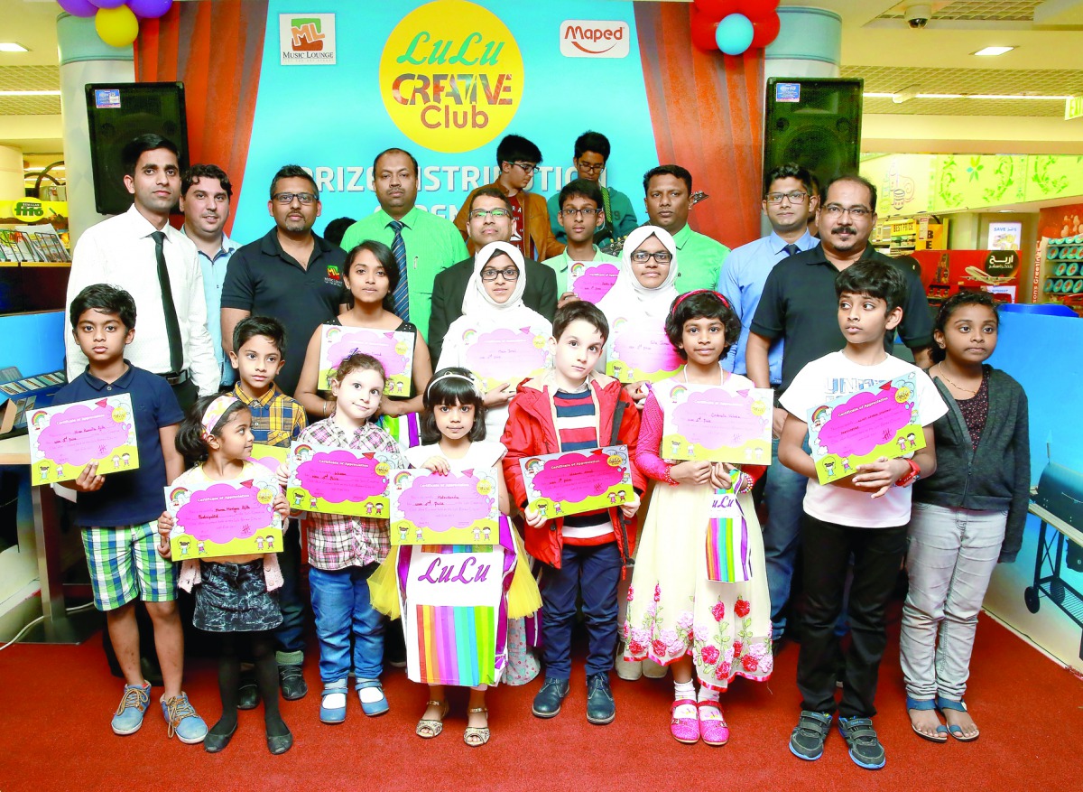 'Lulu Creative Club' contest winners and participants. Below: A member being honoured. 