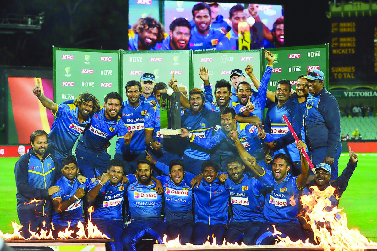 Sri Lankan players and team officials celebrate their T20 series win over Australia after the third T20 at the Adelaide Oval yesterday. 
